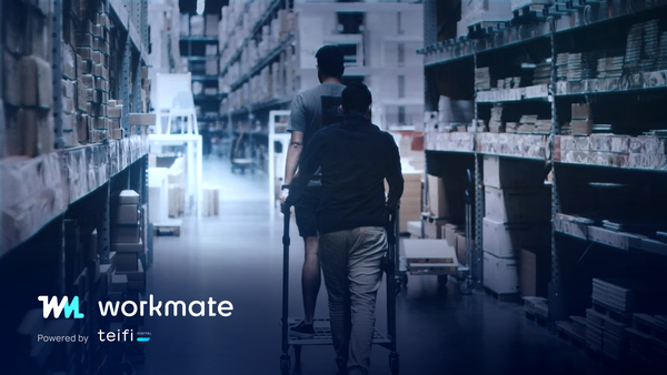 Two retail staff walking a warehouse aisle of racked stock, with the WorkMate wordmark and Powered by Teifi lockup