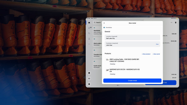Rental check-out running in Shopify POS against a wall of rental ski boots