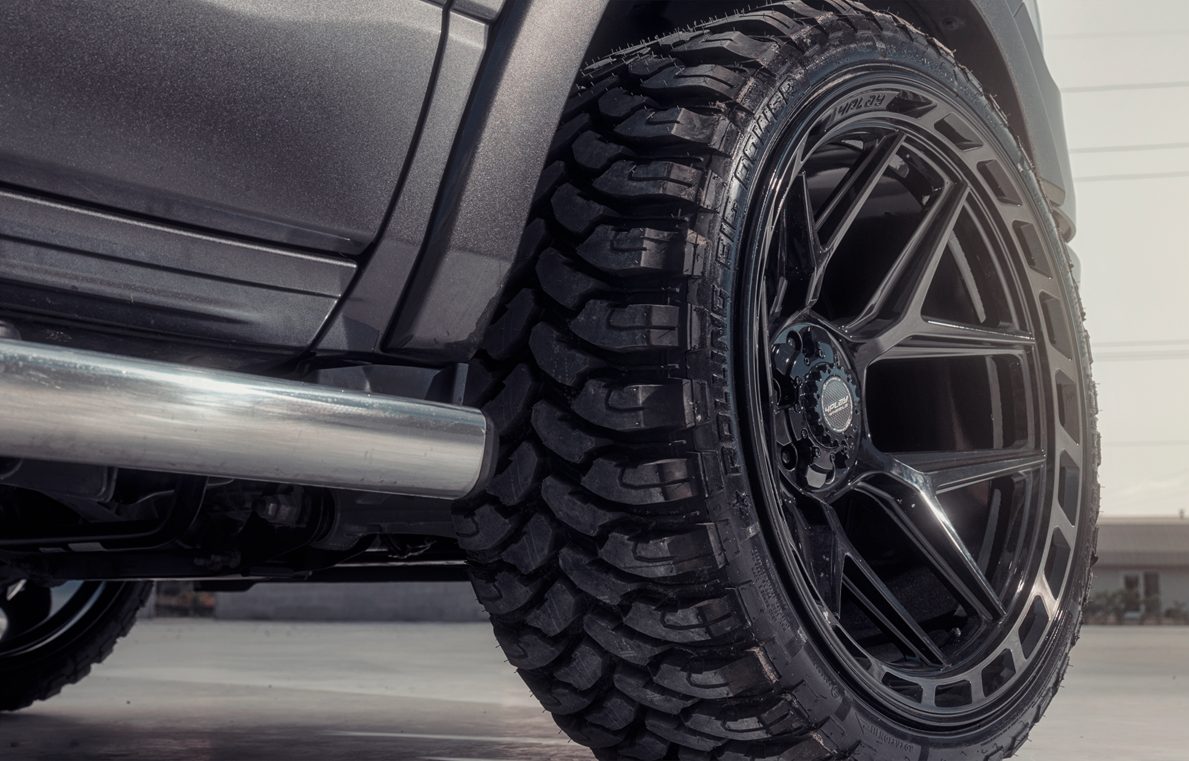 OE Wheels case study, a matte black OE Wheels rim fitted to a lifted pickup truck